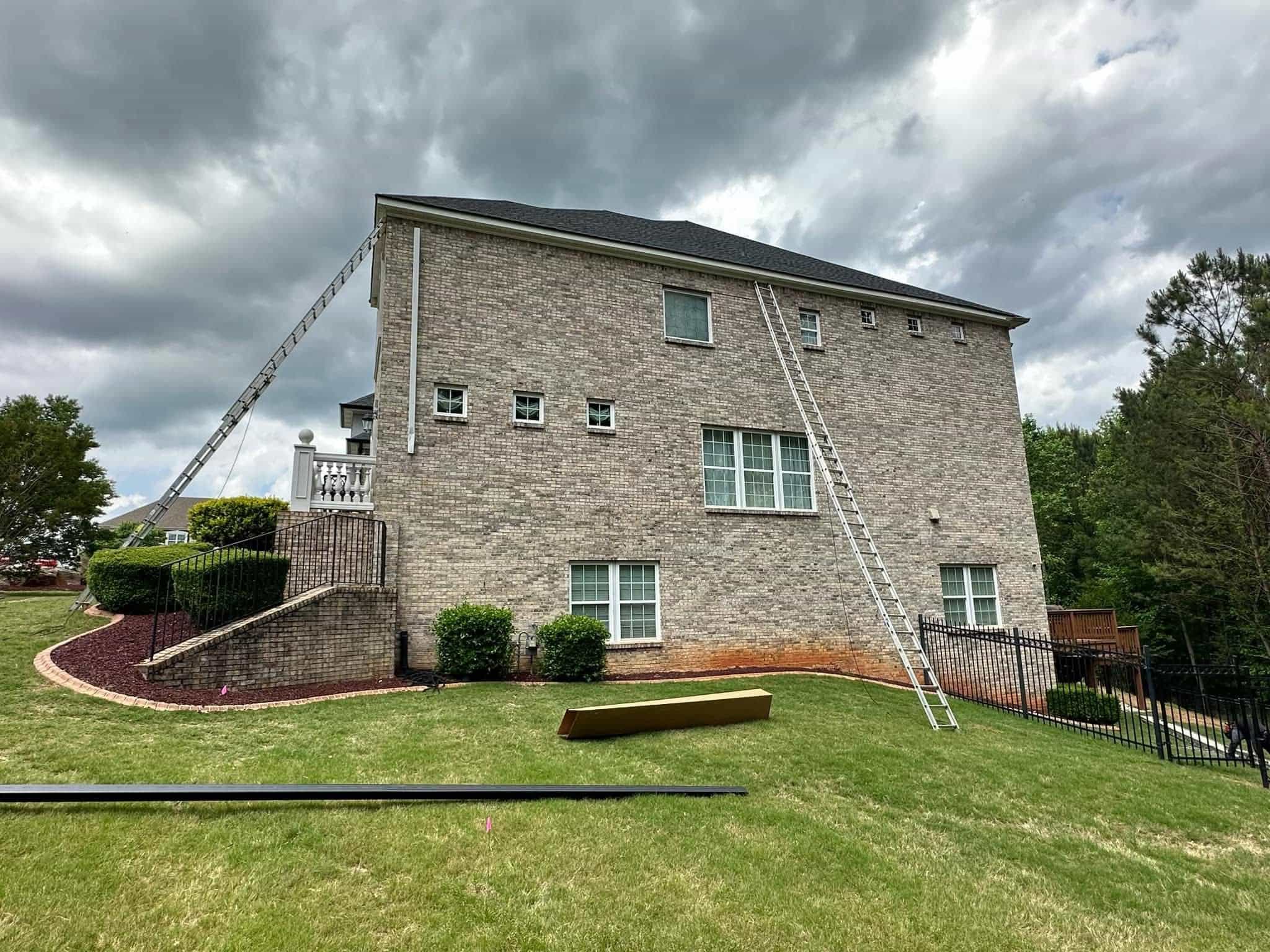 Work in progress — ladders set up on luxury estate for gutter installation