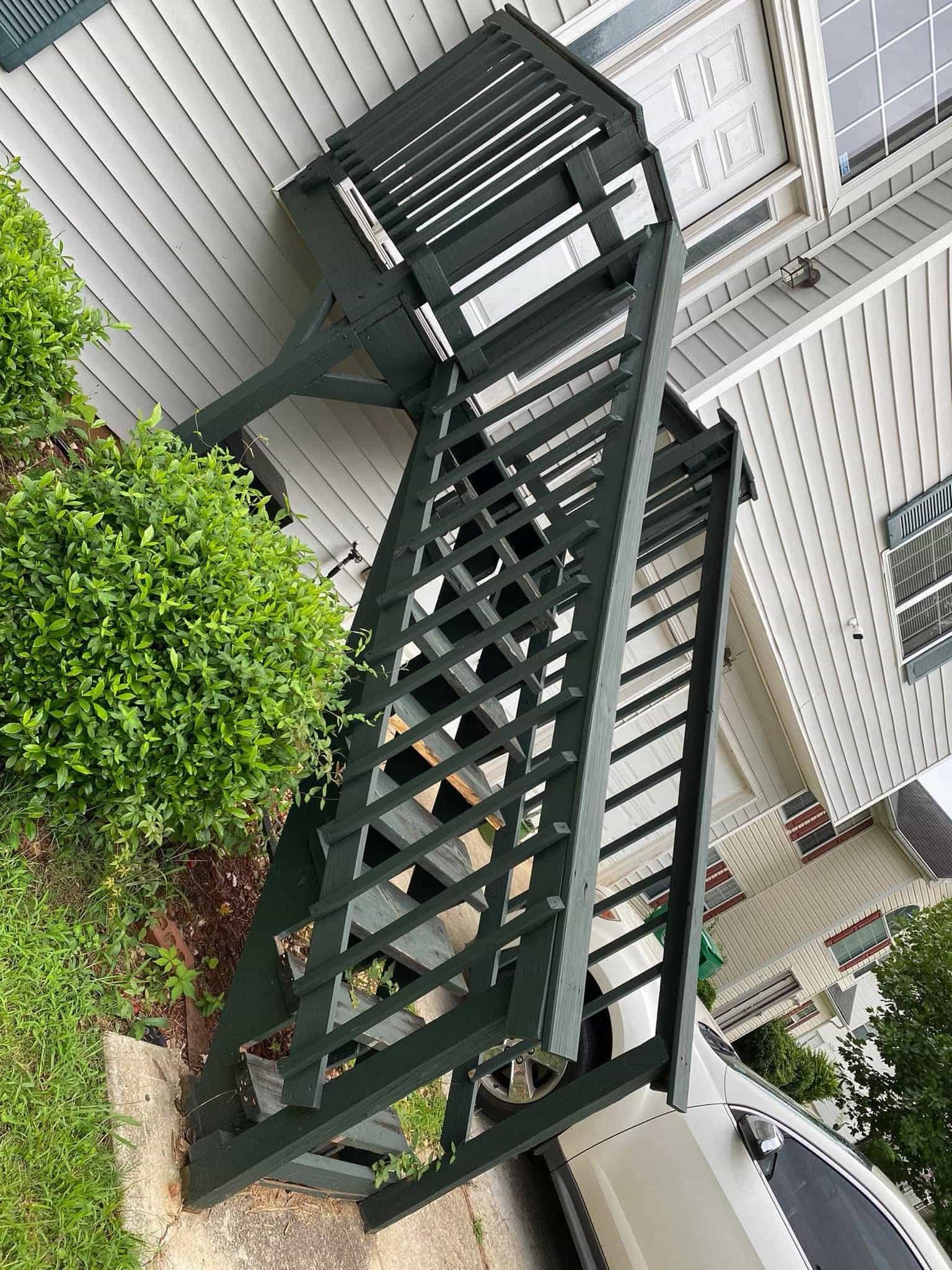 Before — side angle of worn-out wooden stairs with missing treads