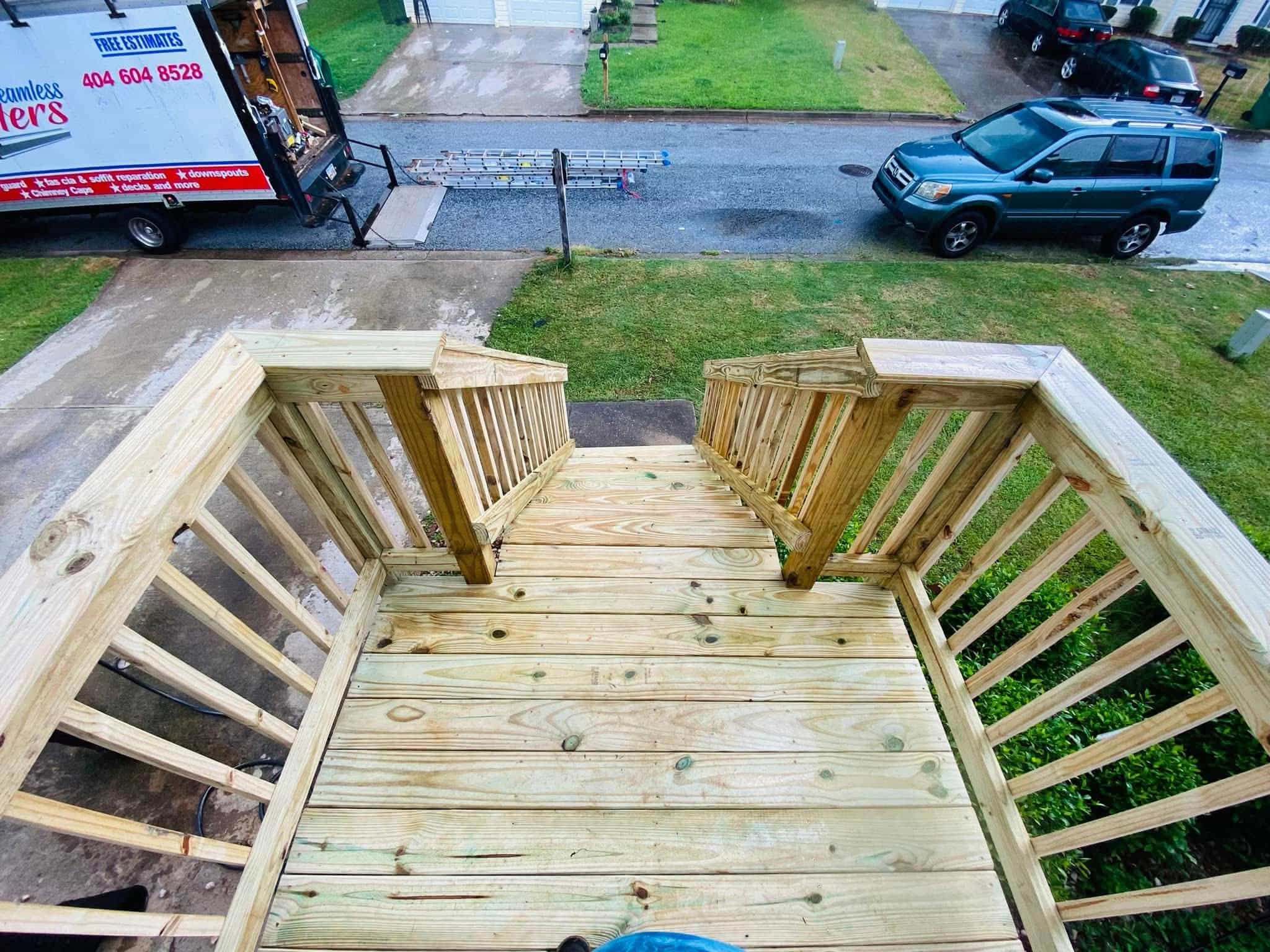 After — overhead view of new deck landing and stairs with A&M truck visible